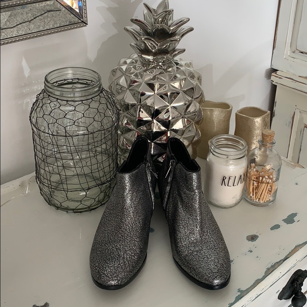 Cracked silver booties.
